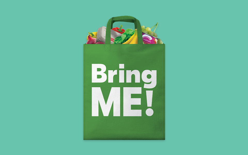 Two kids smiling and waving goodbye.