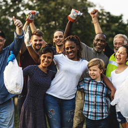 In this image, a group of people is getting their picture taken together.