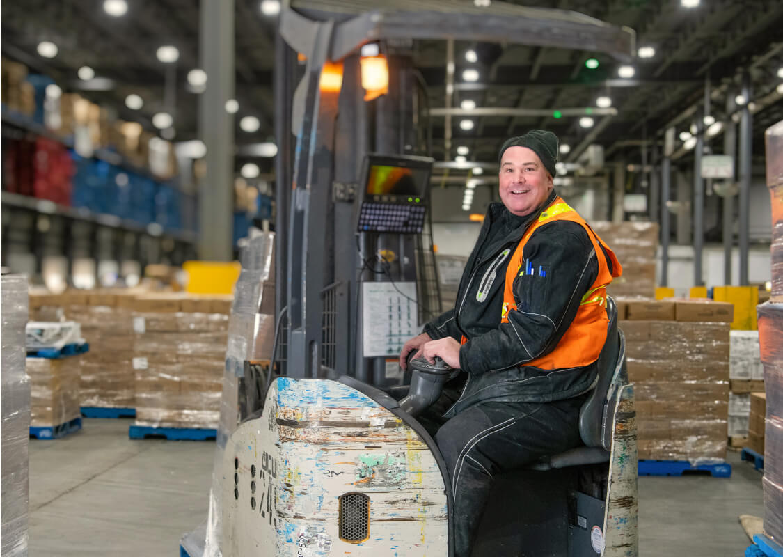 An image of an employee working in a warehouse.